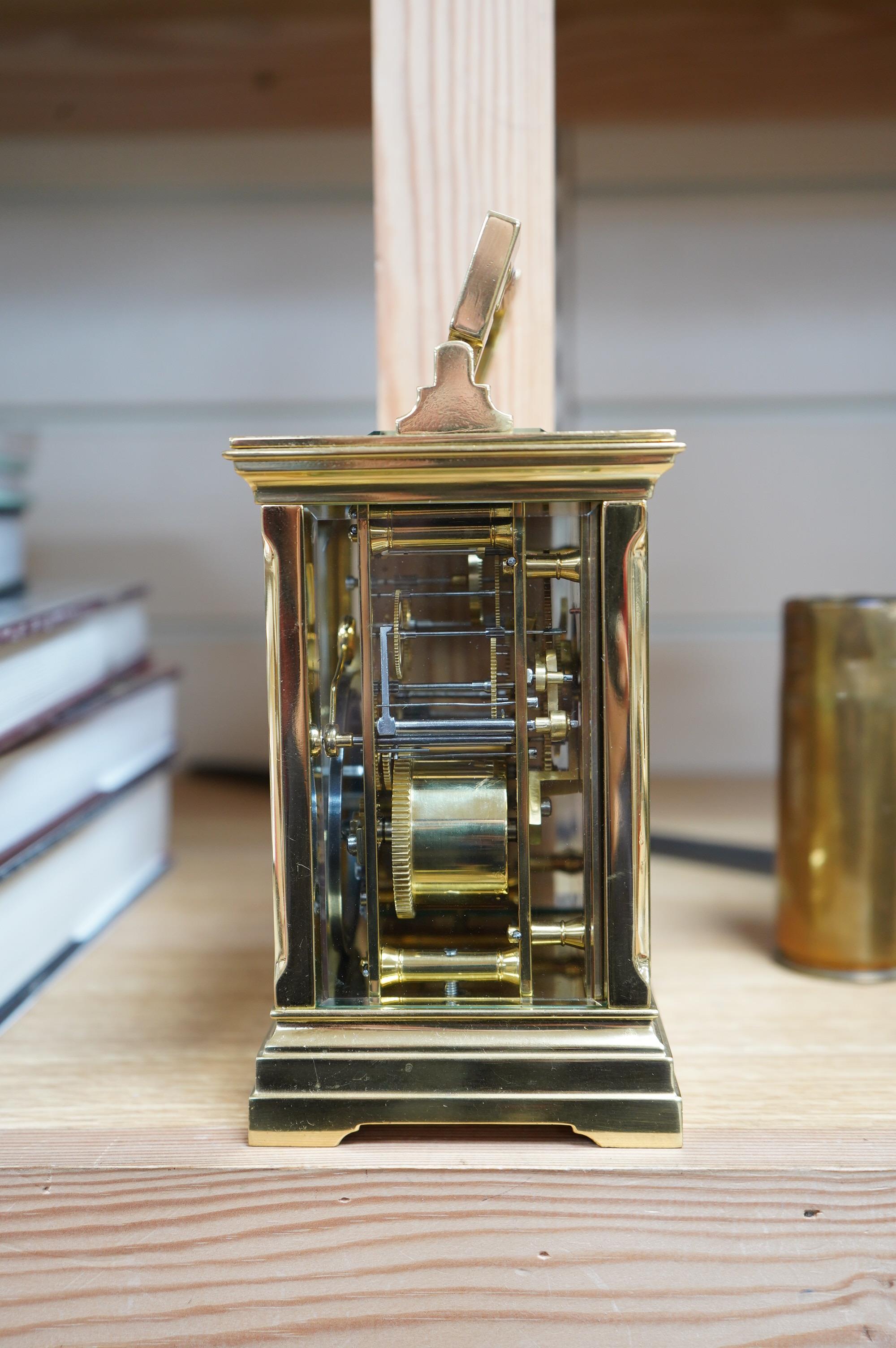 A brass cased carriage clock, the dial inscribed Shepheard & Company, no key, 18cm high. Condition - good, untested